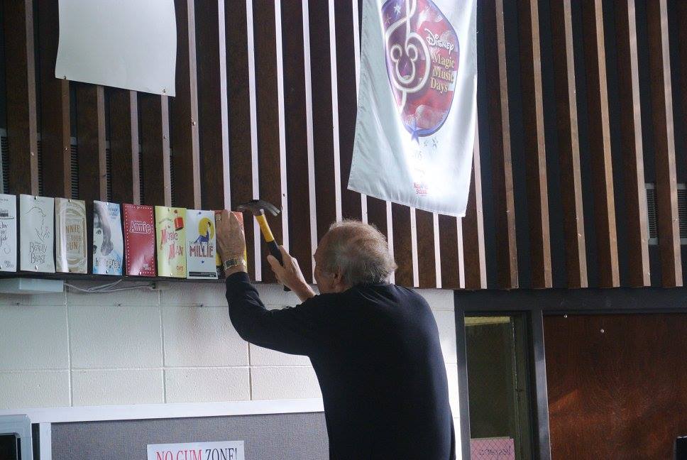 Dan putting up banner